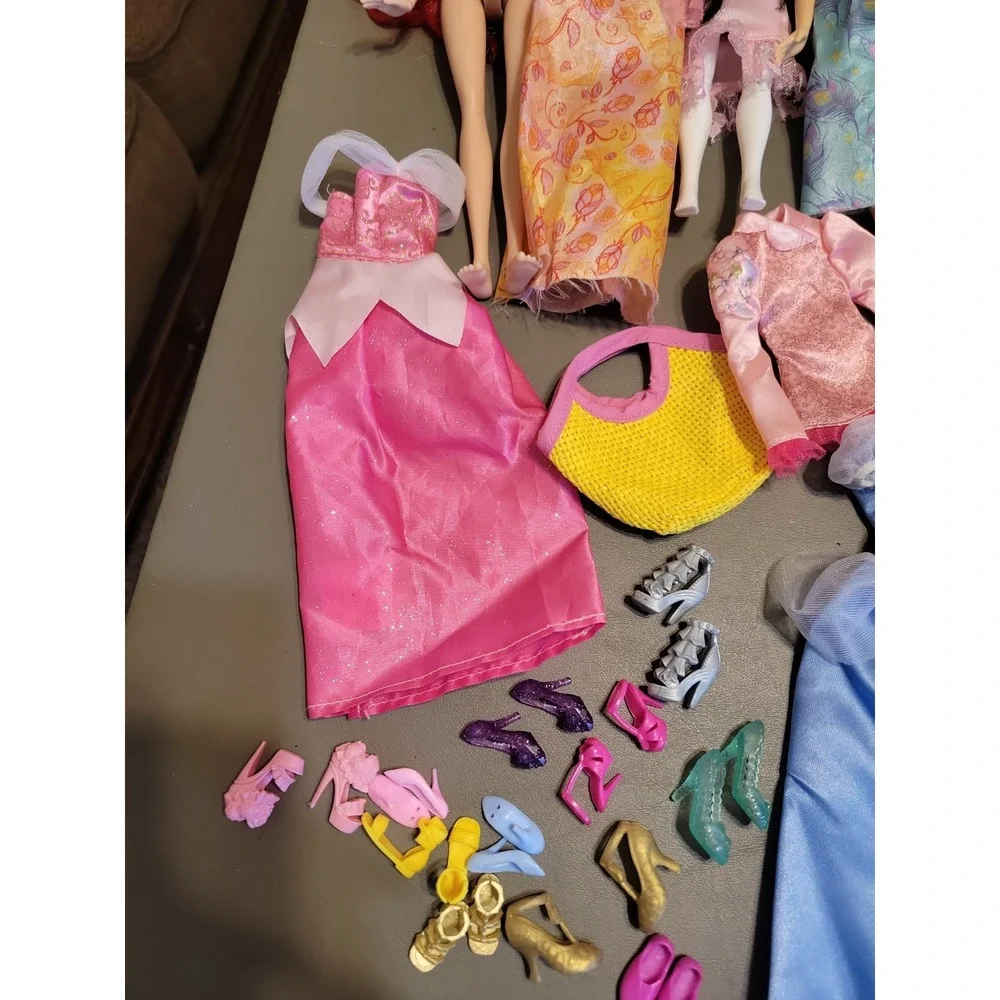 Disney Barbie dolls with extra dresses shoes etc... Mixed lot